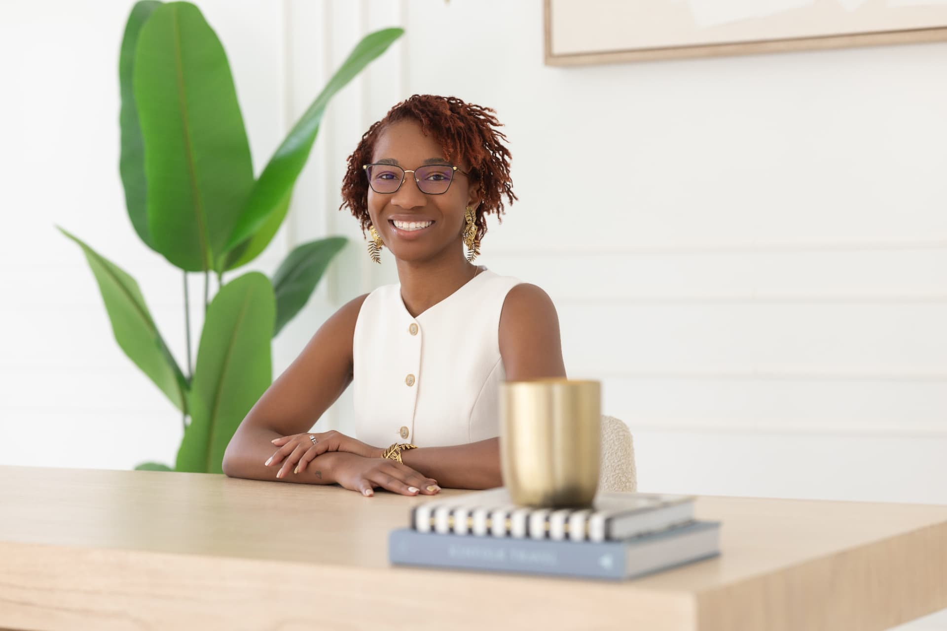 Jessica Brant seated at her desk